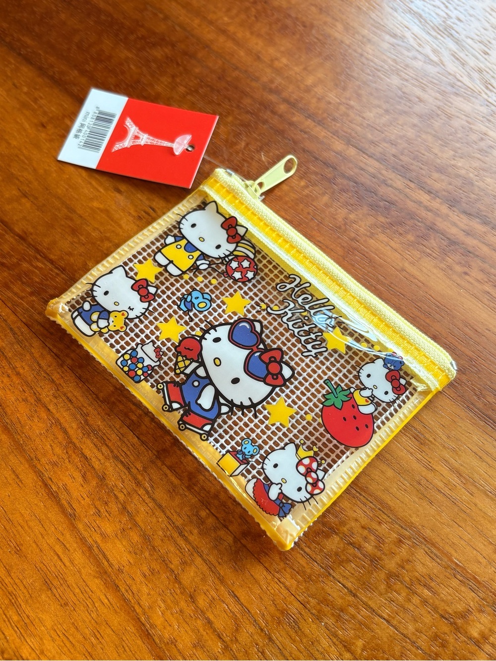 Hello Kitty Rollerblading yellow coin purse NWT.